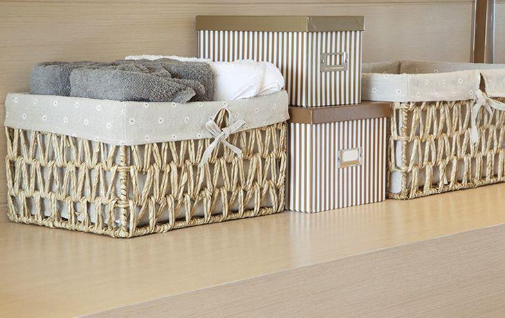 basket of towels on wooden